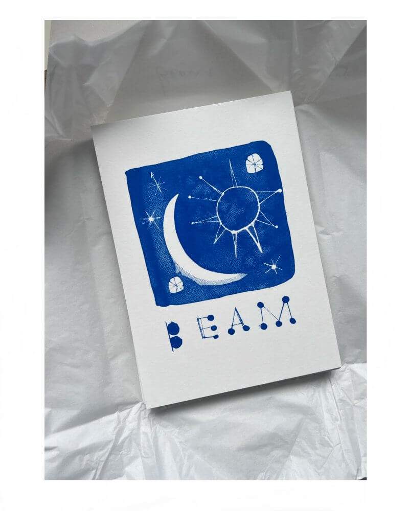 Caroline Tomlinson silkscreen edition. "Beam" - An edition screen print mini by Caroline Tomlinson inspired by the magic of positivity. A5 SIZE – 148.5 mm x 210mm. Edition of 50. Single colour blue prin
