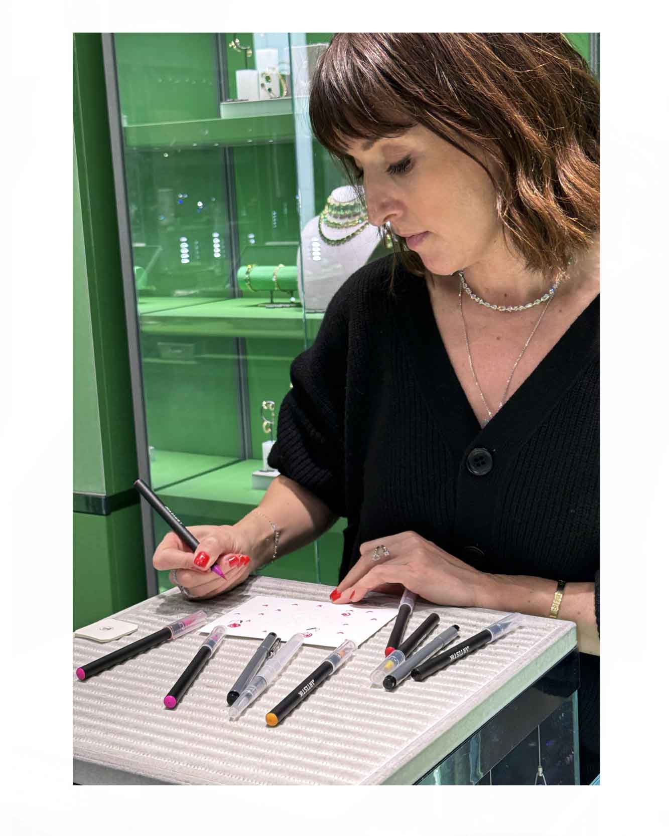 Drawing live for Valentines Day for Swarovski. Offering custimisation for customers. Drawing on packaging and on envelopes. Little roses hand drawn with love hearts along with hand written notes.