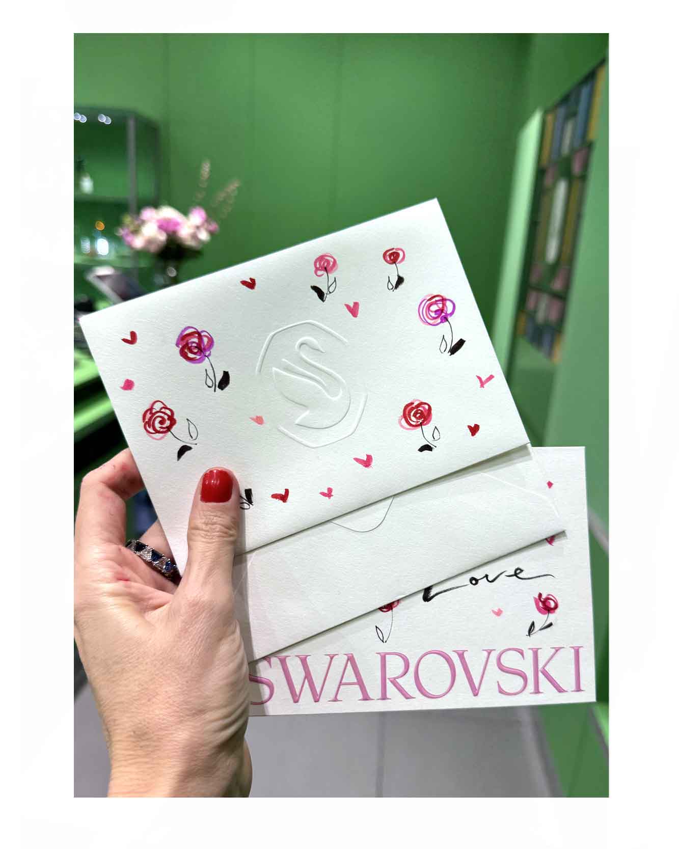 Drawing live for Valentines Day for Swarovski. Offering custimisation for customers. Drawing on packaging and on envelopes. Little roses hand drawn with love hearts along with hand written notes.