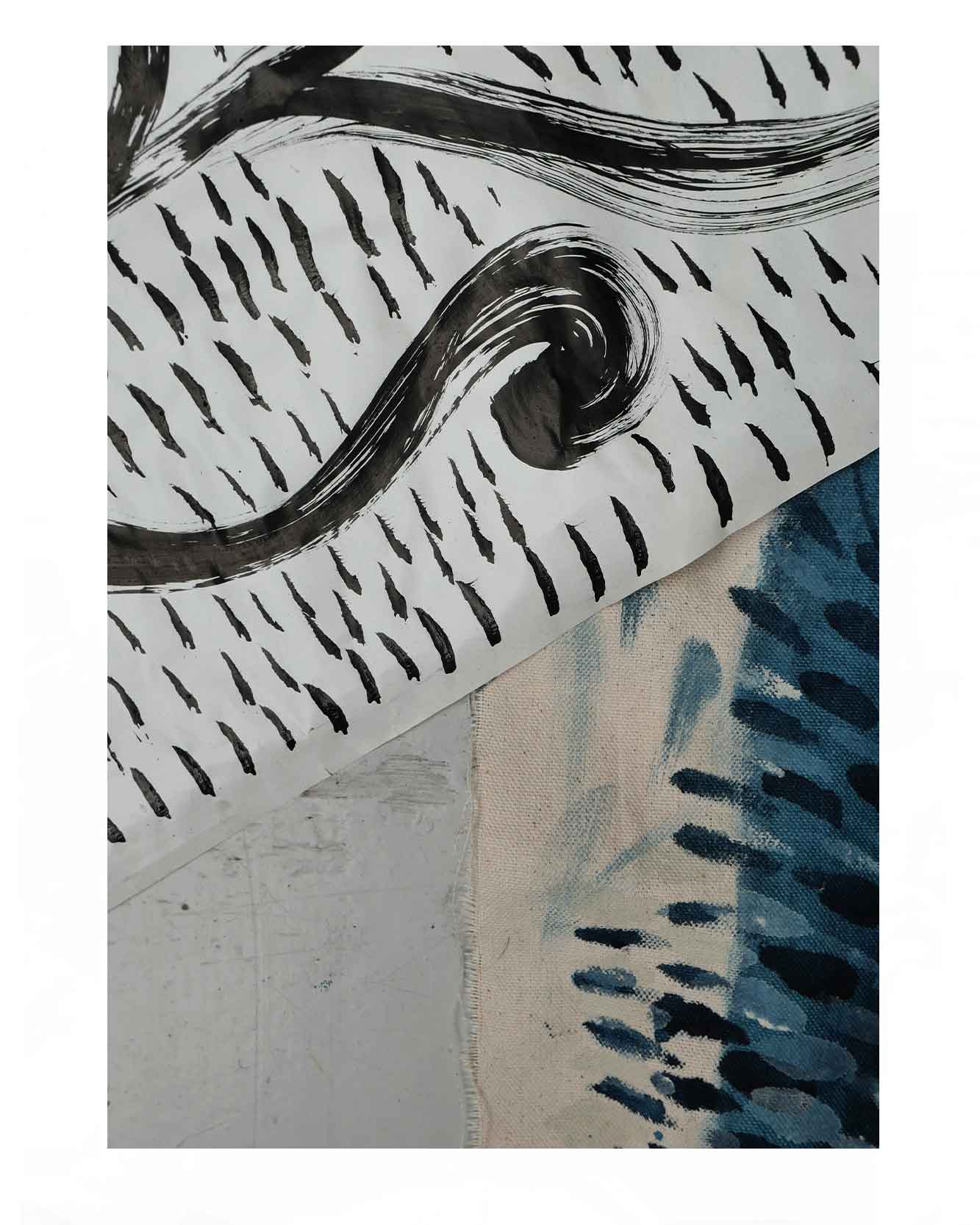 Details initial ink drawings for floral woven textile designs inspired by wild flowers on an artist desk.