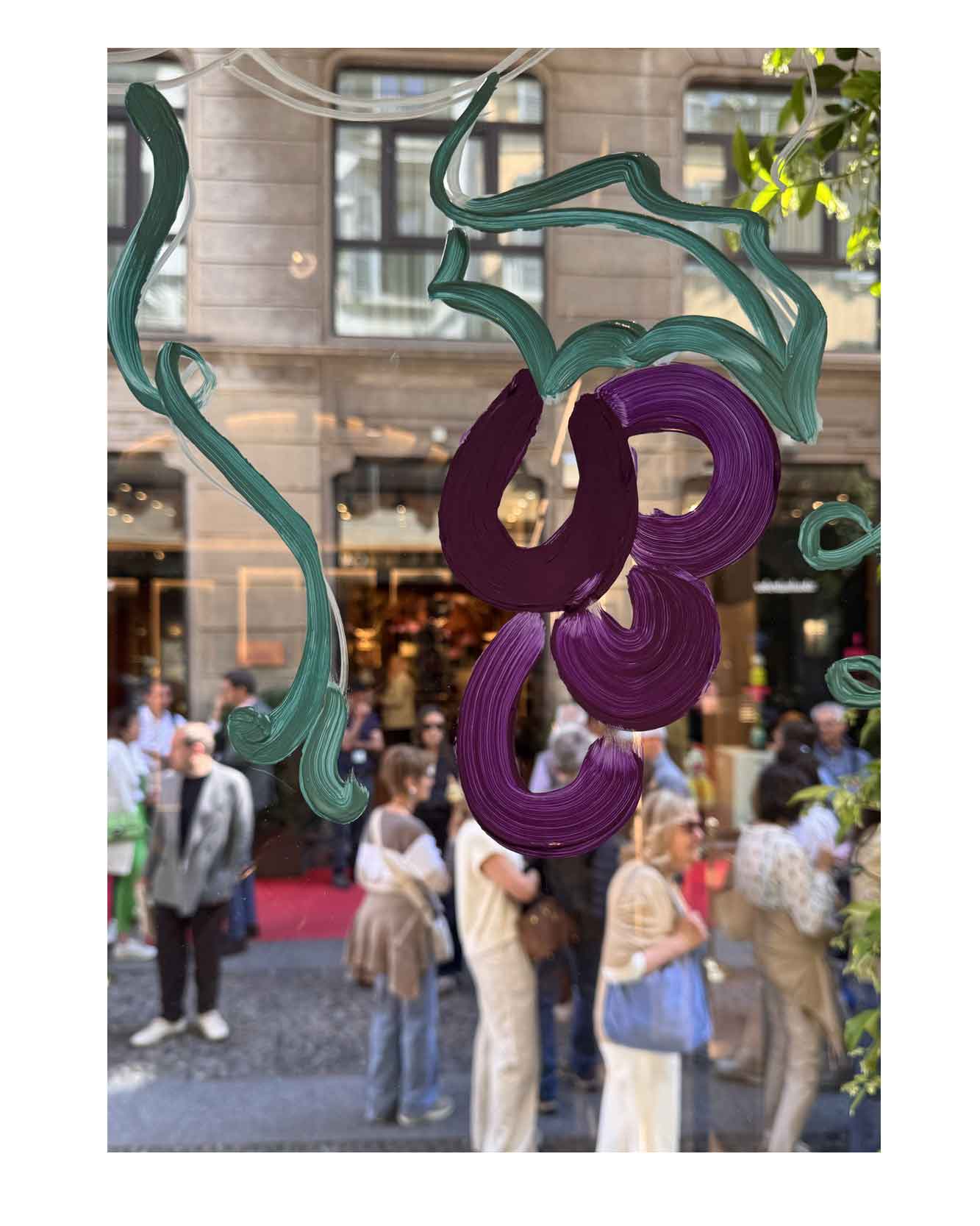 Artist live painting gestural botanical illustrations on large storefront windows during Milan Design Week for a luxury beauty brand, featuring fluid ink lines inspired by nature and fragrance.