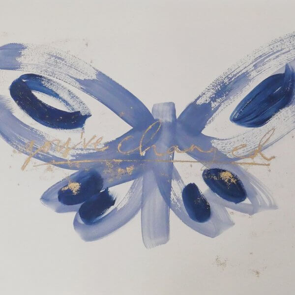 Blue brushstroke butterfly with deep navy wing markings and gold handwritten "you've changed - unfolding", original art by Caroline Tomlinson